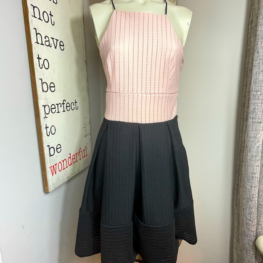 Twilight Simon’s blush and black color block halter box pleat dress